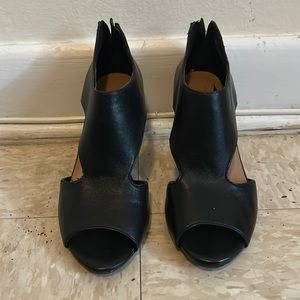 Black leather pumps